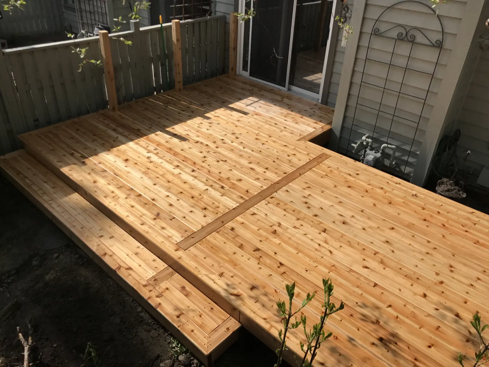 Pressure-treated deck under construction by Lamacraft